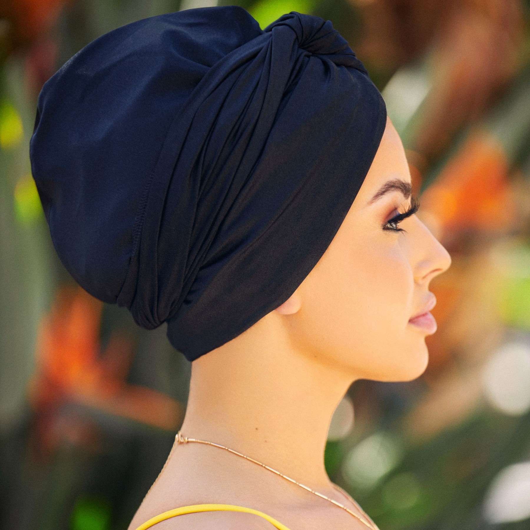 A girl wearing black turban feeling fashionable
